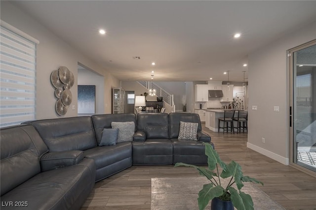 2650 Skylark Trail St, Henderson, NV 89044 - living area with light wood finished floors, a chandelier, recessed lighting, and baseboards