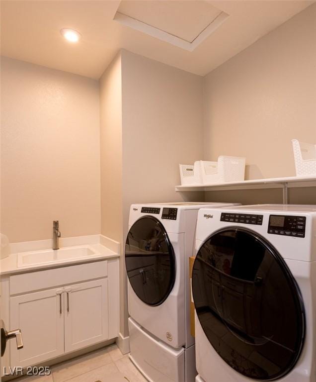 2650 Skylark Trail St, Henderson, NV 89044 - laundry area featuring independent washer and dryer, light tile patterned floors, and cabinet space