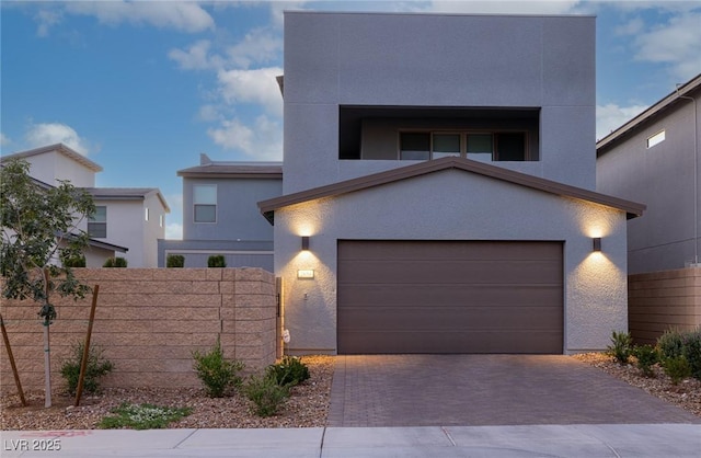 2650 Skylark Trail St, Henderson, NV 89044 - contemporary house featuring stucco siding, decorative driveway, and an attached garage
