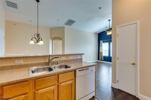 kitchen with visible vents, dark wood-style floors, a sink, and dishwasher
