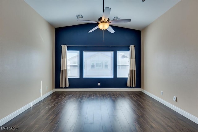 empty room with visible vents, ceiling fan, wood finished floors, and lofted ceiling