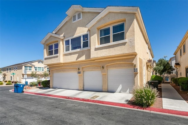 6576 Buster Brown Ave Unit 101, Las Vegas, NV 89122 - townhome / multi-family property featuring stucco siding and an attached garage