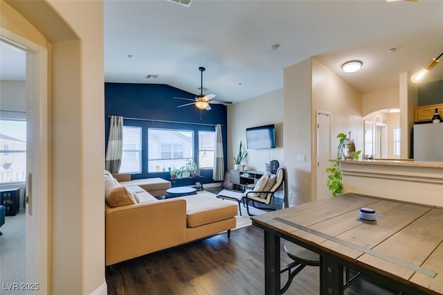 6576 Buster Brown Ave Unit 101, Las Vegas, NV 89122 - living room featuring lofted ceiling, ceiling fan, dark wood-style floors, and arched walkways