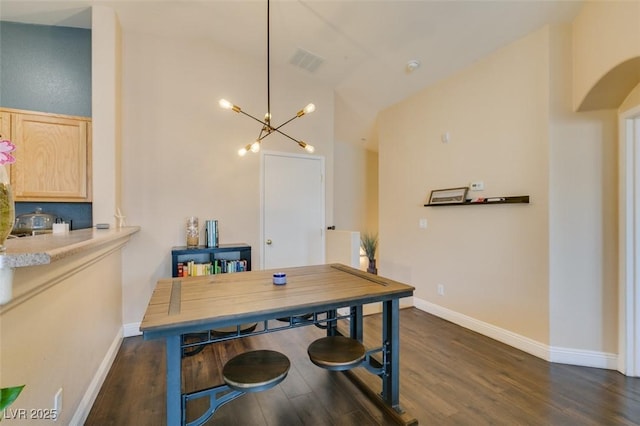 6576 Buster Brown Ave Unit 101, Las Vegas, NV 89122 - dining space with dark wood-type flooring, a chandelier, high vaulted ceiling, baseboards, and arched walkways