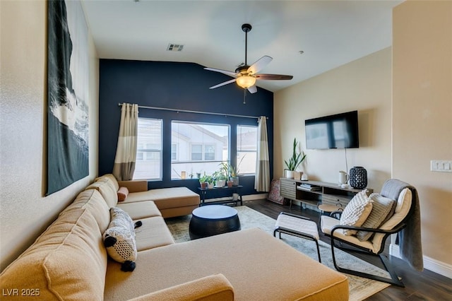 6576 Buster Brown Ave Unit 101, Las Vegas, NV 89122 - living area with baseboards, lofted ceiling, ceiling fan, and dark wood finished floors
