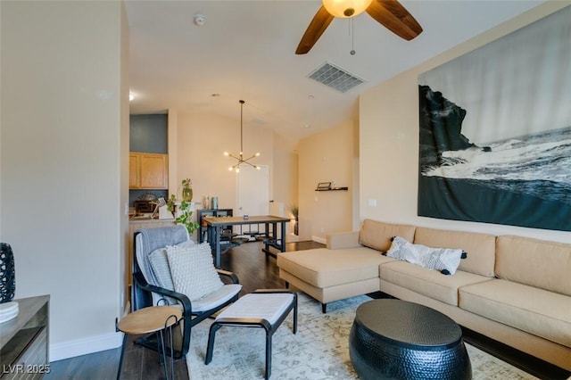 6576 Buster Brown Ave Unit 101, Las Vegas, NV 89122 - living room featuring wood finished floors, a chandelier, a ceiling fan, lofted ceiling, and baseboards