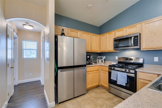 6576 Buster Brown Ave Unit 101, Las Vegas, NV 89122 - kitchen featuring stainless steel appliances, light brown cabinetry, and light countertops
