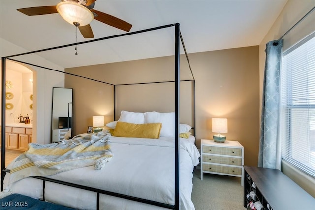 6576 Buster Brown Ave Unit 101, Las Vegas, NV 89122 - carpeted bedroom with ensuite bath and vaulted ceiling