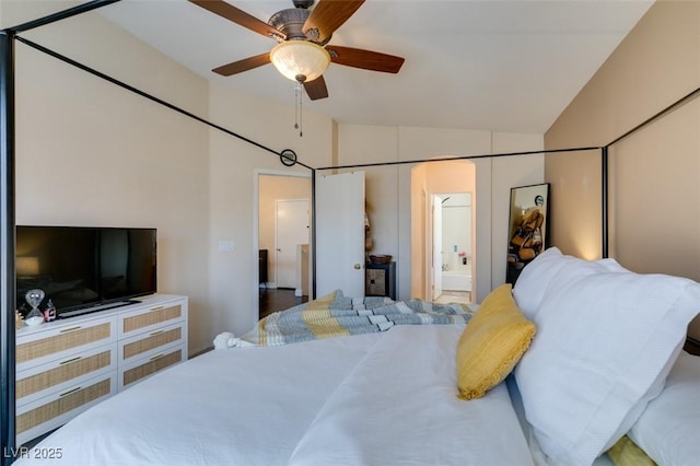 6576 Buster Brown Ave Unit 101, Las Vegas, NV 89122 - bedroom with vaulted ceiling, ensuite bath, and a ceiling fan