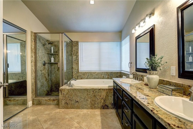 full bath featuring a sink, tile patterned flooring, a garden tub, and a stall shower