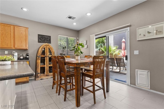 dining area with recessed lighting and baseboards
