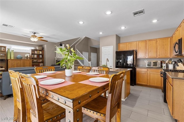 dining room with stairs, a ceiling fan, and recessed lighting