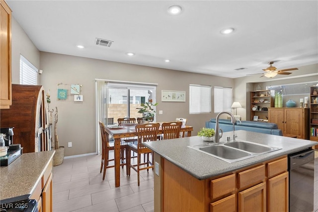 kitchen featuring a sink, dishwasher, ceiling fan, a kitchen island with sink, and recessed lighting