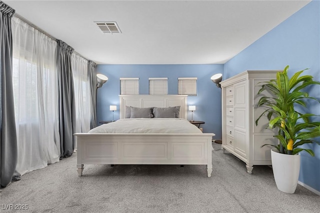 bedroom featuring light carpet
