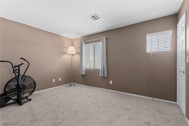 interior space featuring carpet floors and baseboards