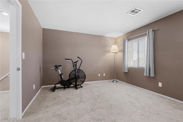 exercise room with carpet flooring and baseboards