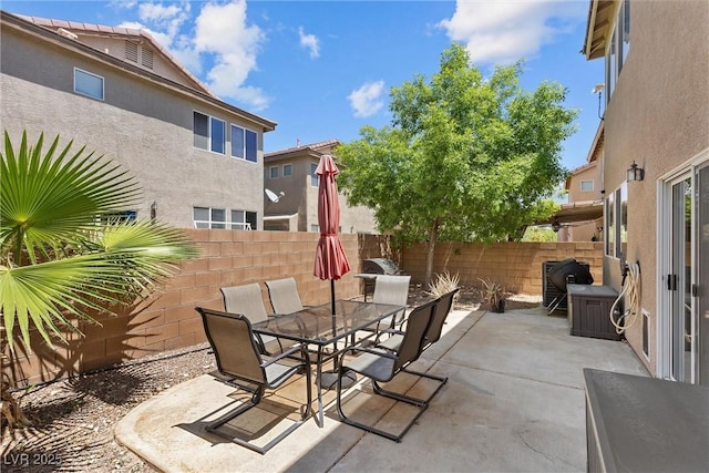 view of patio with fence and outdoor dining area