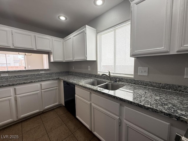 2105 William Holden Ct, Las Vegas, NV 89142 - kitchen featuring dark tile patterned floors, dishwasher, a sink, recessed lighting, and white cabinetry