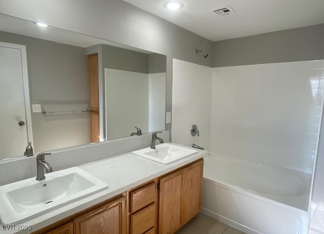 2105 William Holden Ct, Las Vegas, NV 89142 - bathroom with visible vents, a sink, washtub / shower combination, and double vanity