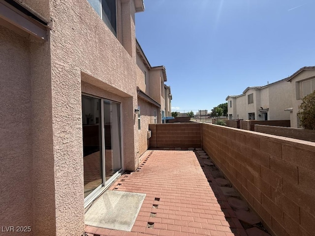 2105 William Holden Ct, Las Vegas, NV 89142 - view of property exterior featuring a residential view, a fenced backyard, and stucco siding