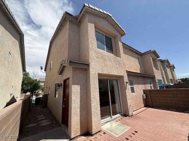 2105 William Holden Ct, Las Vegas, NV 89142 - rear view of house with stucco siding and fence