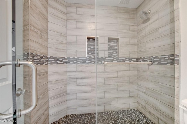 full bath featuring a shower stall