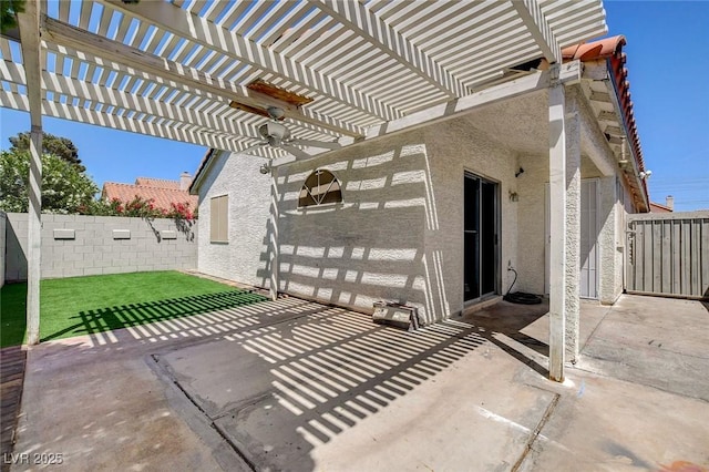 view of patio / terrace featuring a fenced backyard, a ceiling fan, and a pergola