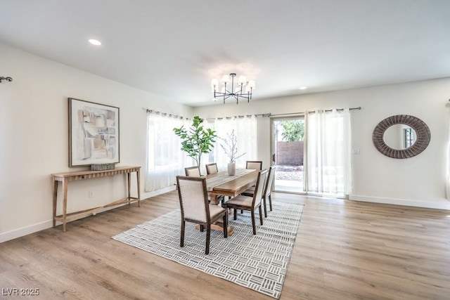 dining room featuring recessed lighting, baseboards, a chandelier, and light wood-type flooring