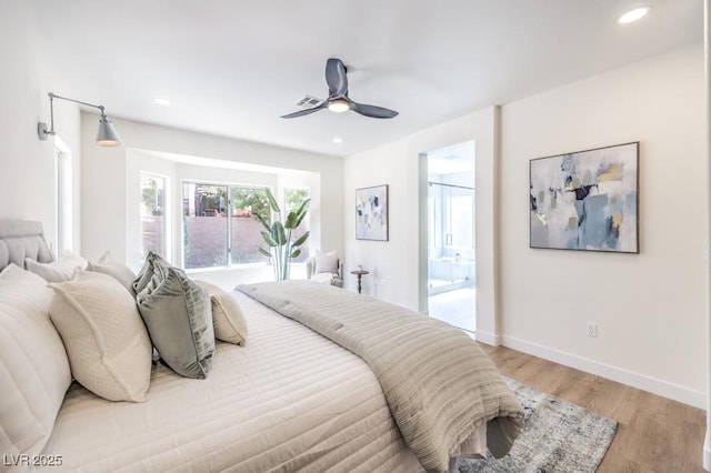 bedroom featuring a ceiling fan, baseboards, connected bathroom, recessed lighting, and light wood-style flooring