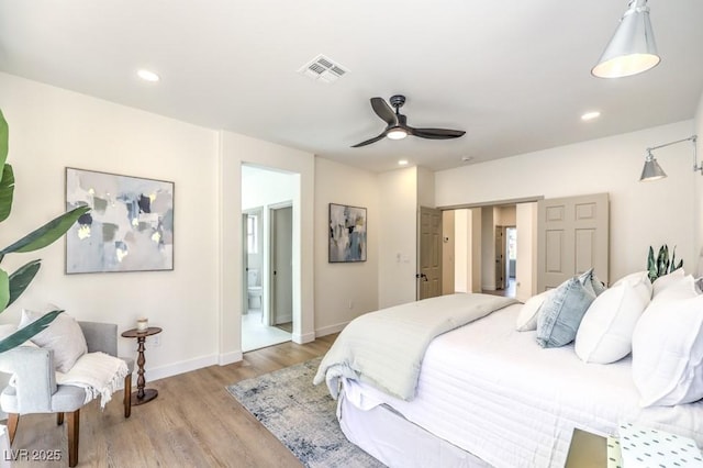 bedroom with visible vents, recessed lighting, light wood-style floors, and baseboards