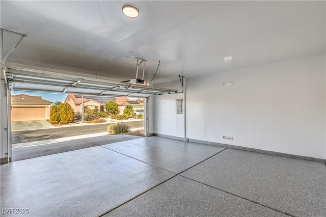 garage featuring baseboards