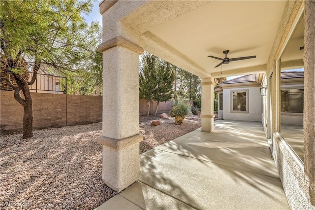 view of patio featuring ceiling fan and a fenced backyard