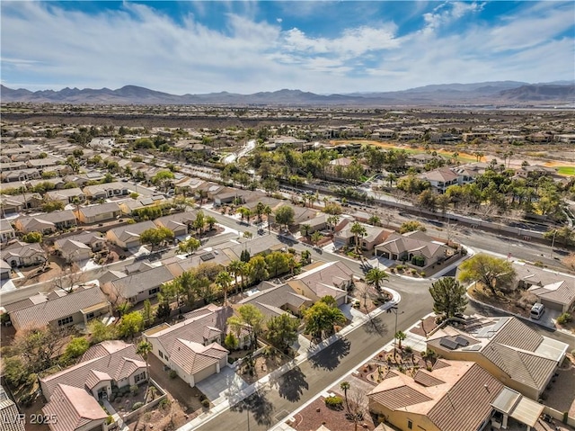 drone / aerial view featuring a residential view and a mountain view