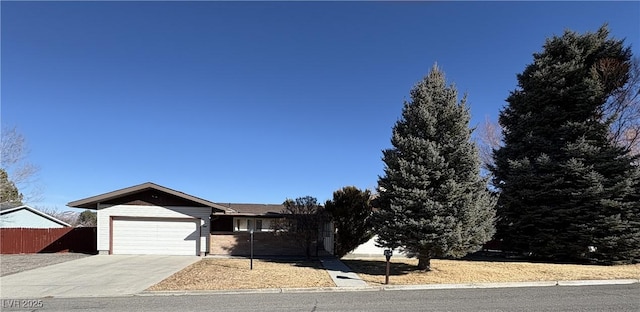 1090E 15th St, Ely, NV 89301 - ranch-style house featuring a garage, fence, and driveway