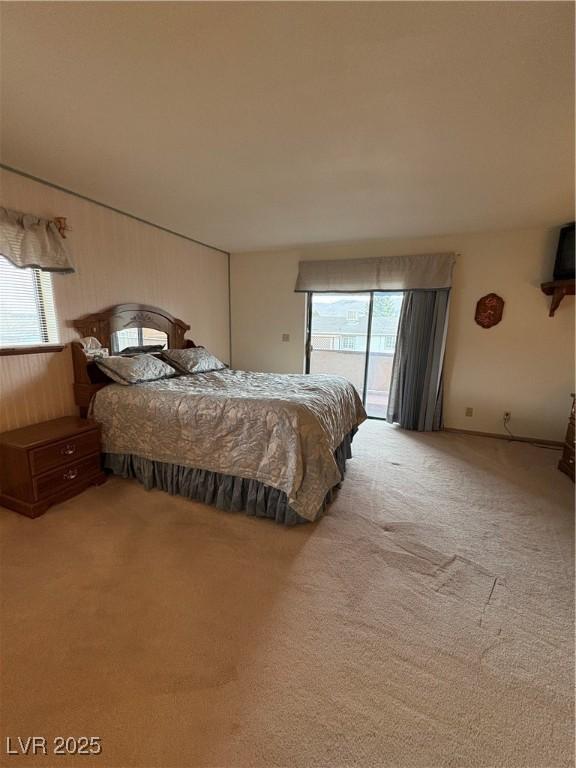 1090E 15th St, Ely, NV 89301 - carpeted bedroom with access to outside