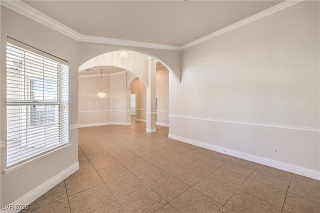 unfurnished room featuring crown molding, arched walkways, baseboards, and light tile patterned floors