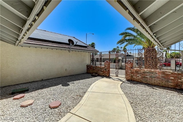 exterior space with fence and a gate