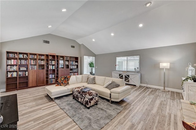 living area with recessed lighting, high vaulted ceiling, visible vents, and light wood finished floors