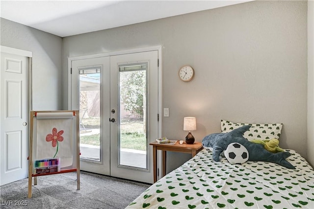 bedroom with french doors, carpet, and access to outside