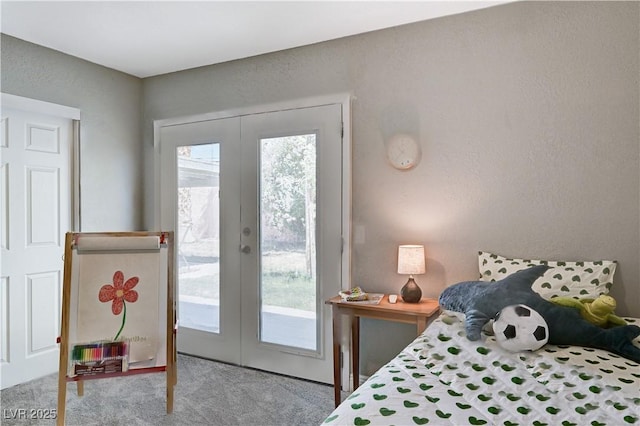carpeted bedroom featuring access to outside and french doors