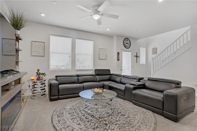664 Foam Flower Ln, Henderson, NV 89015 - living area with light colored carpet, ceiling fan, stairway, and recessed lighting