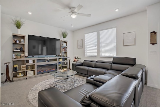 664 Foam Flower Ln, Henderson, NV 89015 - carpeted living area featuring a ceiling fan, a glass covered fireplace, recessed lighting, and baseboards