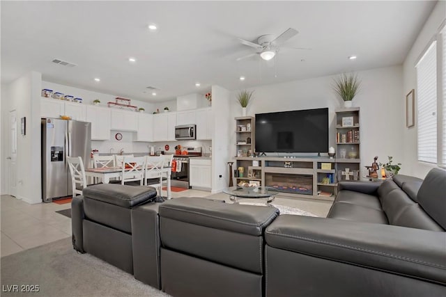 664 Foam Flower Ln, Henderson, NV 89015 - living area with a ceiling fan, healthy amount of natural light, recessed lighting, and light tile patterned floors