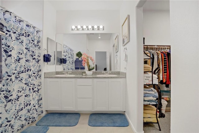 664 Foam Flower Ln, Henderson, NV 89015 - full bathroom featuring double vanity, tile patterned floors, and a shower with shower curtain