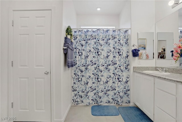 664 Foam Flower Ln, Henderson, NV 89015 - full bathroom with vanity, a shower with shower curtain, and tile patterned flooring