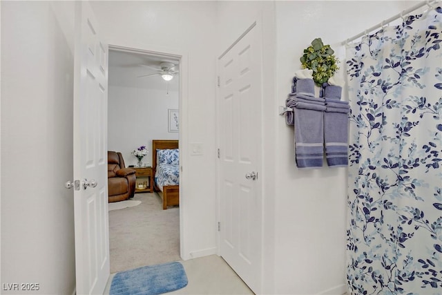 664 Foam Flower Ln, Henderson, NV 89015 - bathroom with curtained shower, a ceiling fan, and baseboards