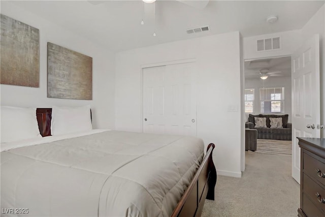 664 Foam Flower Ln, Henderson, NV 89015 - bedroom with light colored carpet, a closet, a ceiling fan, and baseboards