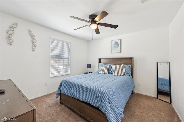 bedroom featuring carpet floors, a ceiling fan, and baseboards