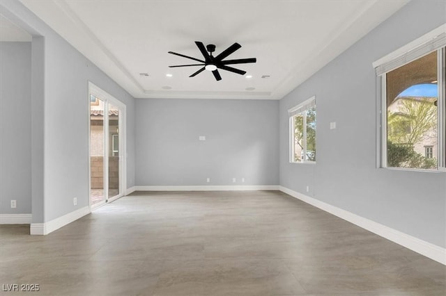 empty room with baseboards, recessed lighting, finished concrete flooring, and ceiling fan