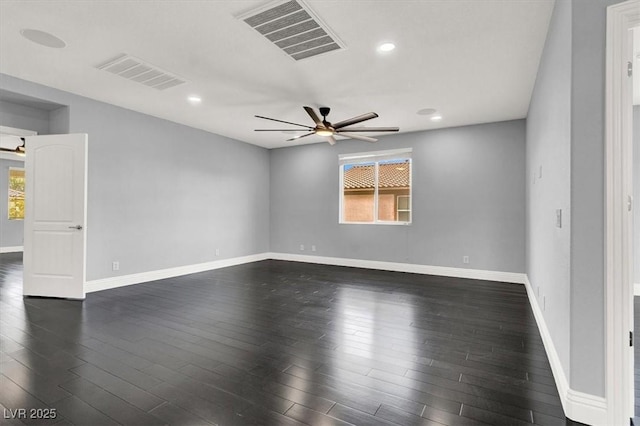 empty room with ceiling fan, visible vents, and plenty of natural light